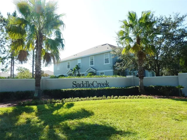 a view of a swimming pool with a yard