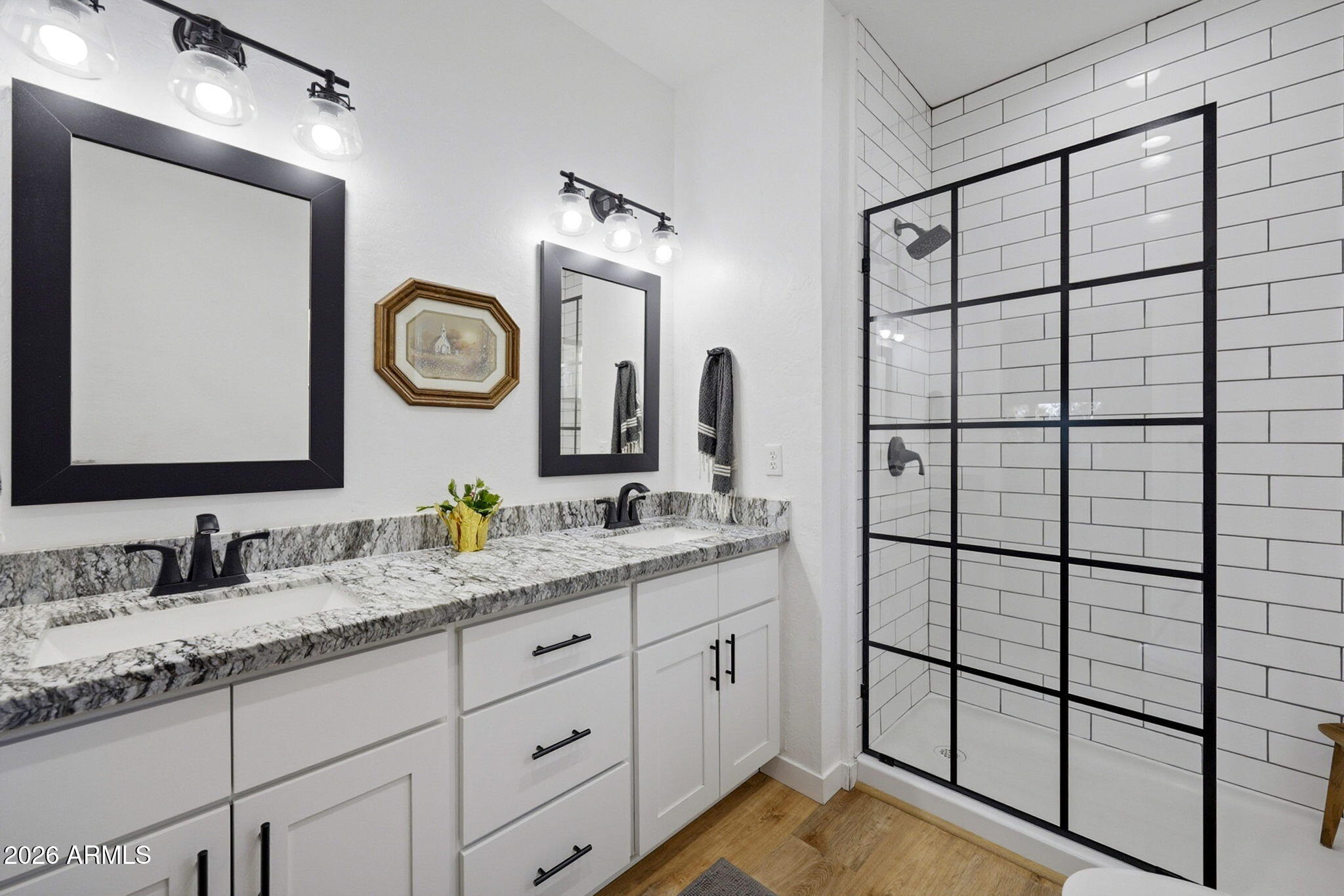 2225 Roundabout Way Overgaard, AZ 85933 - Photo 12 of 32 a bathroom with a double vanity sink and a mirror