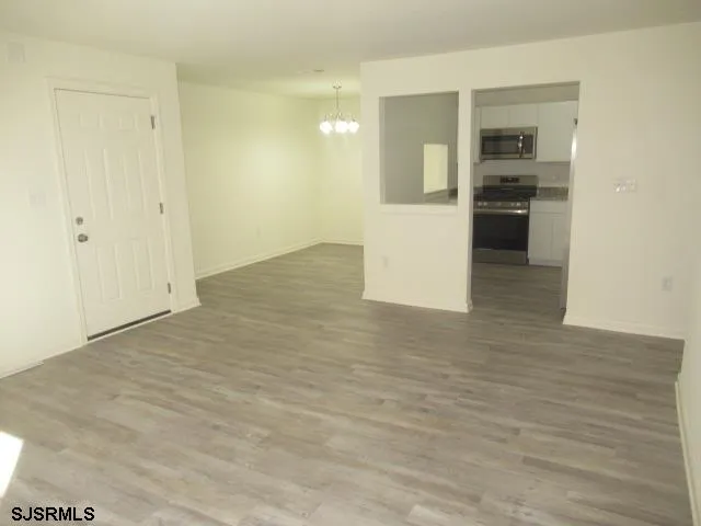 a view of a kitchen cabinets and wooden floor