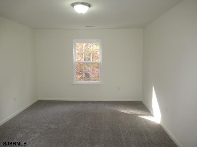 35 Apache Court, Unit 35 Galloway Township, NJ 08205 - Photo 7 of 10 an empty room with a window
