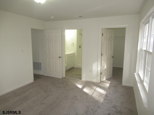 35 Apache Court, Unit 35 Galloway Township, NJ 08205 - Photo 9 of 10 an empty room with windows and closet