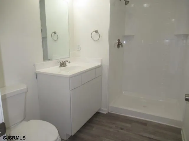 a bathroom with a sink toilet and vanity