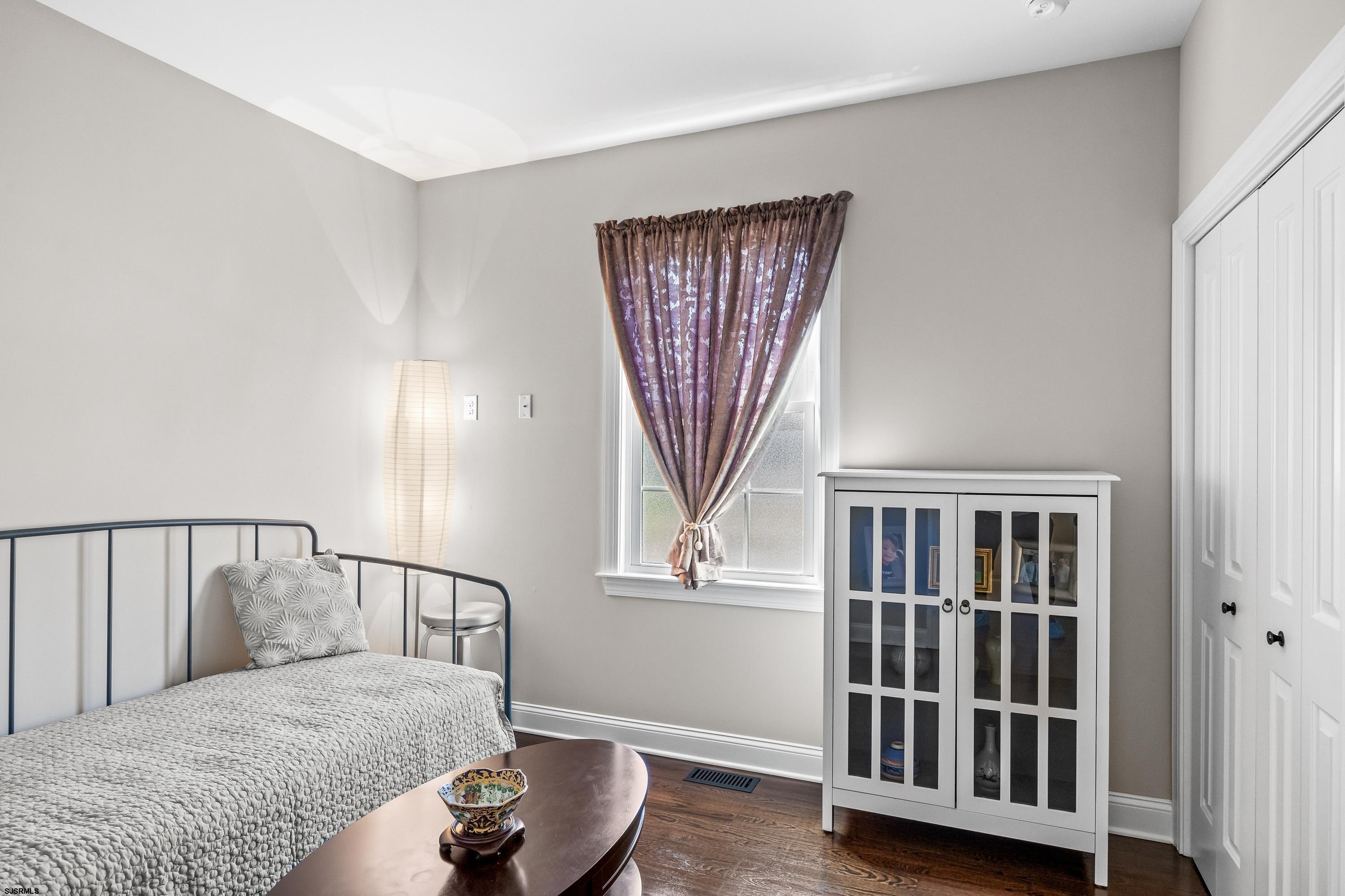 215 Surf Road Egg Harbor Township, NJ 08234 - Photo 18 of 31 a bedroom with a bed and a window