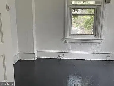 view of a closet with wooden floor
