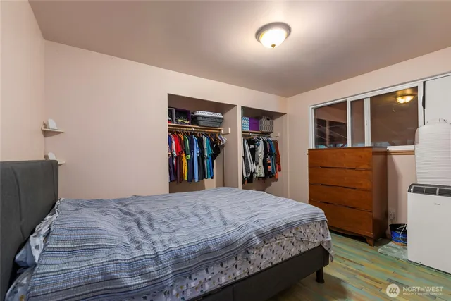 a bedroom with a bed and a closet