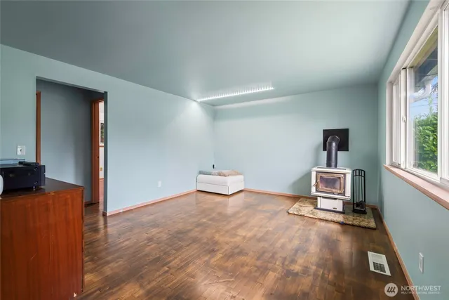 an empty room with furniture and a window