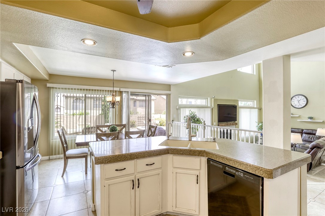 3692 River Canyon Road Las Vegas, NV 89129 - Photo 27 of 97 So much natural light from the wall of windows at the back of the house.
