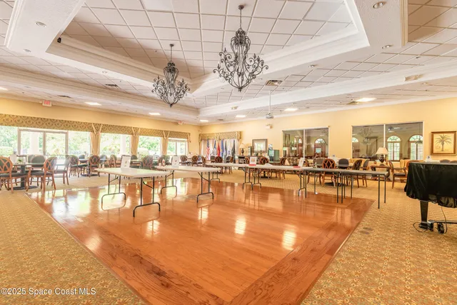 a view of a swimming pool with outdoor seating