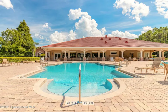 a view of a house with swimming pool