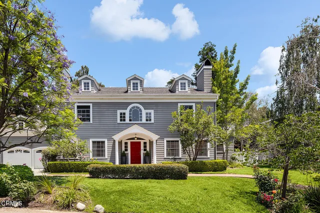 a front view of house with yard and green space