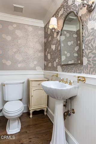 a bathroom with a toilet and a sink