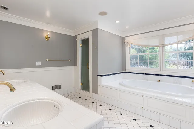 a bathroom with a bathtub and a sink