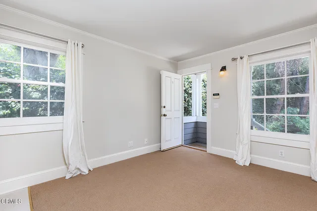 an empty room with windows