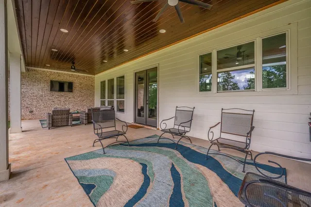 a building outdoor space with patio couches and a potted plant