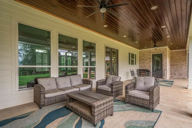 a front view of a house with yard and green space