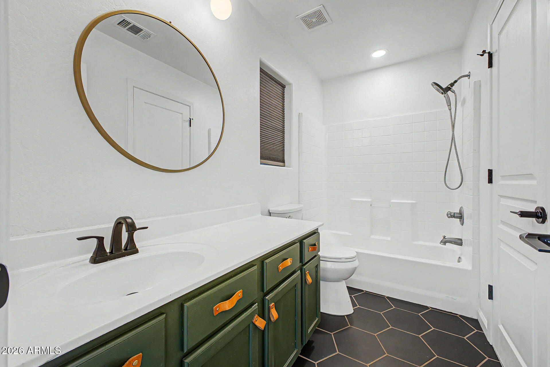 451 South Hawes Road, Unit 27 Mesa, AZ 85208 - Photo 20 of 27 a bathroom with a sink a toilet and a mirror