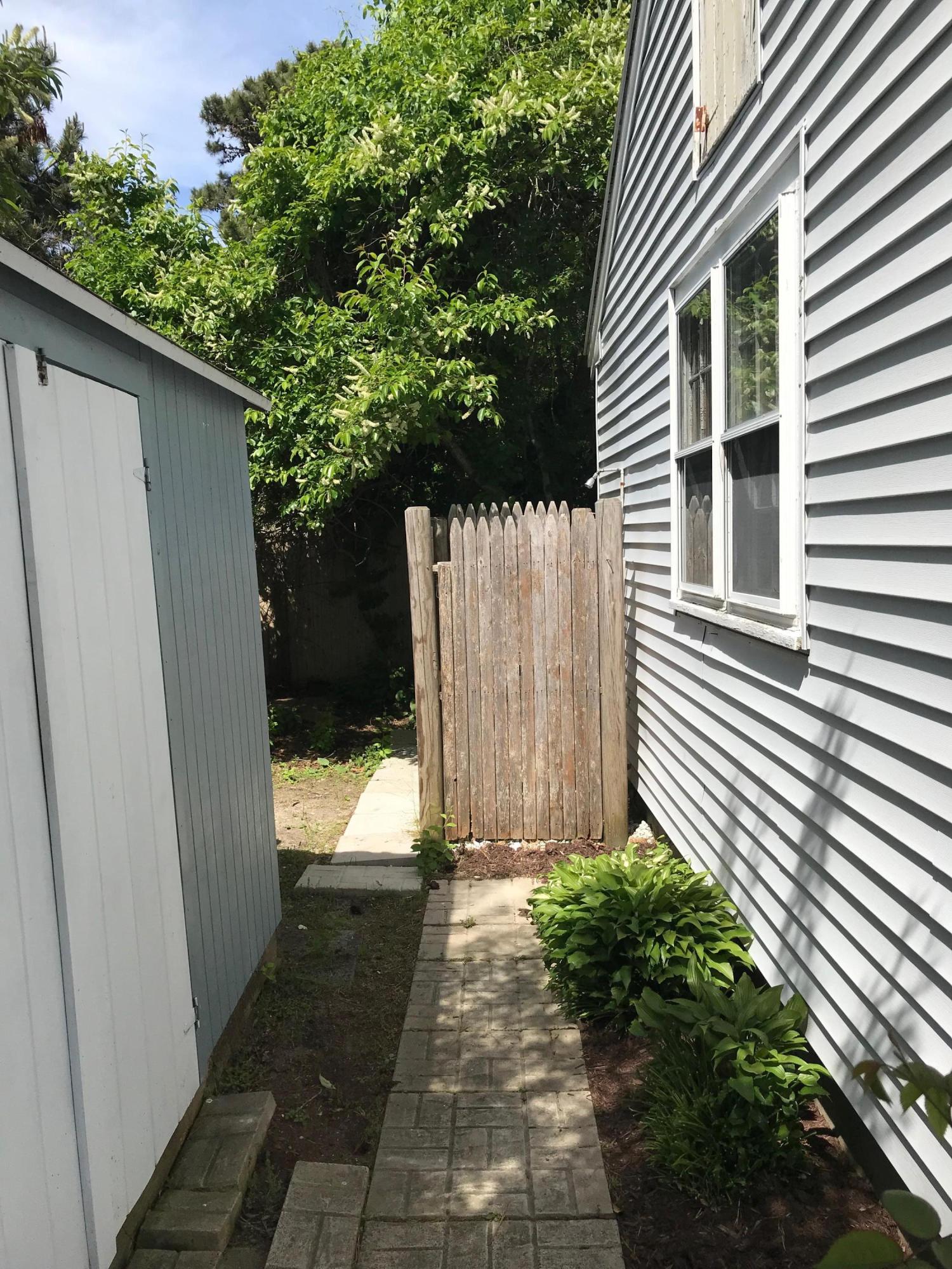 49 Lower County Road, Unit U 7 Dennis Port, MA 02639 - Photo 13 of 23 a view of a back yard of the house