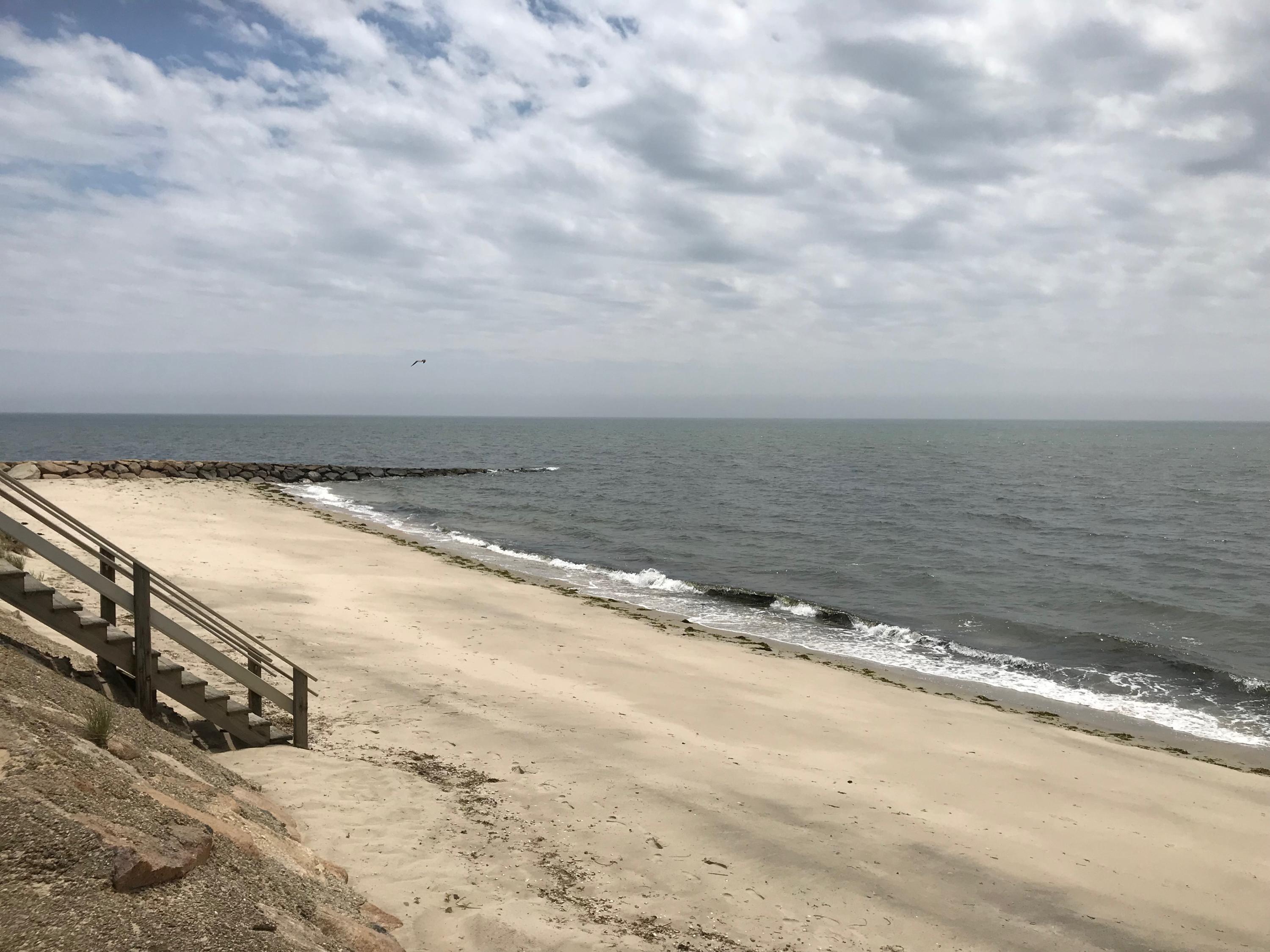 49 Lower County Road, Unit U 7 Dennis Port, MA 02639 - Photo 16 of 23 a view of an ocean beach