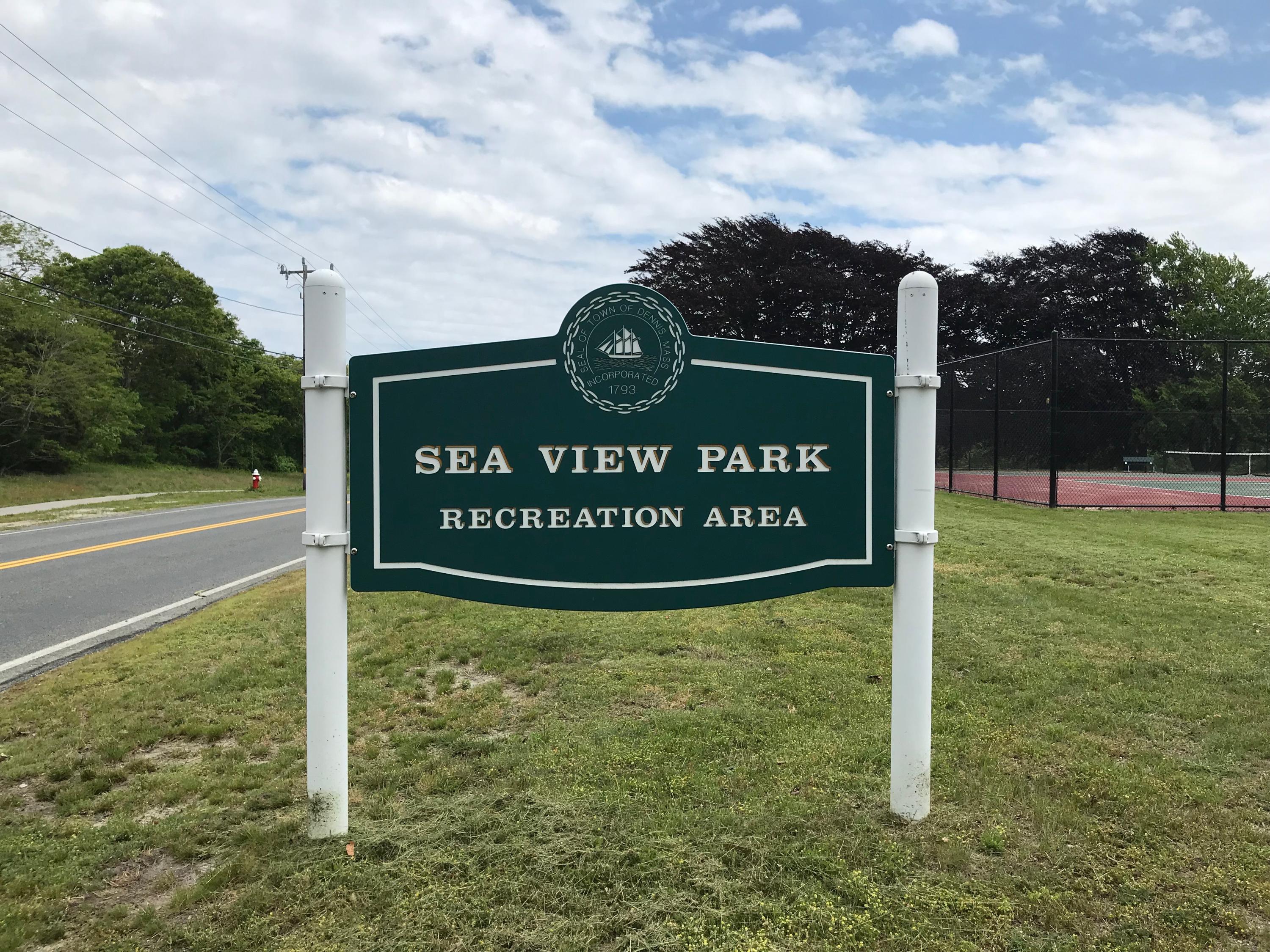 49 Lower County Road, Unit U 7 Dennis Port, MA 02639 - Photo 22 of 23 a sign on the side of the road