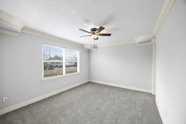 a very nice looking room with a ceiling fan