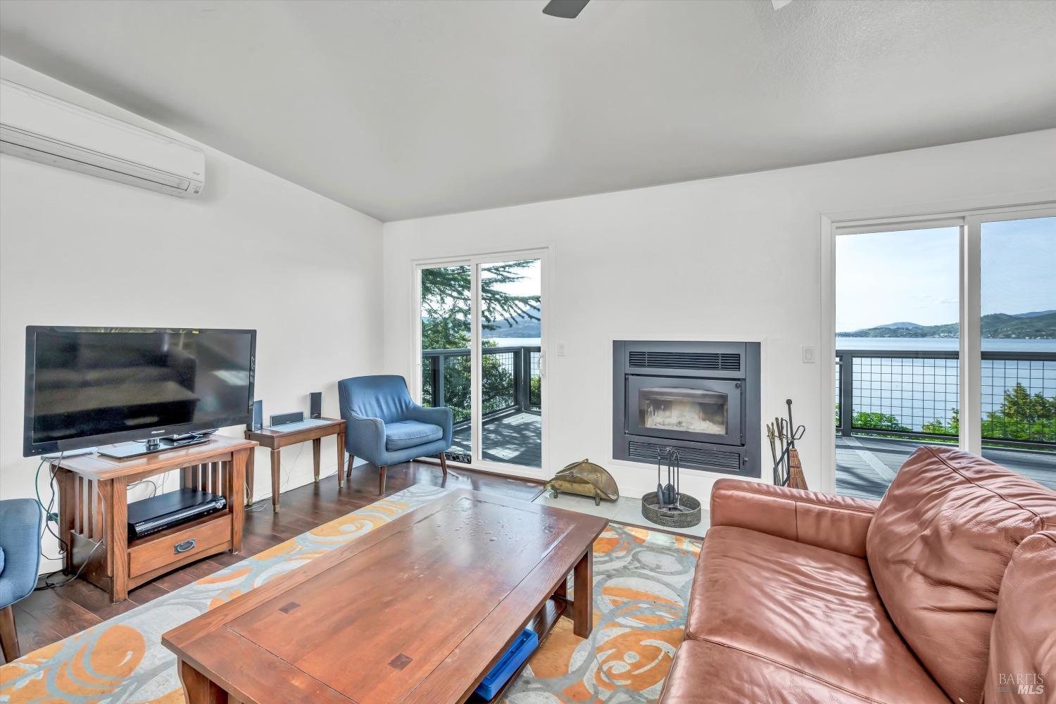 13624 Anderson Road Lower Lake, CA 95457 - Photo 12 of 31 a living room with furniture a flat screen tv and a large window