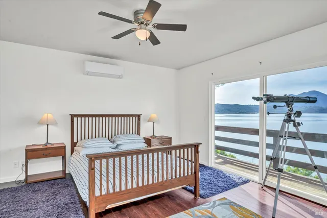 a bedroom with furniture and a window
