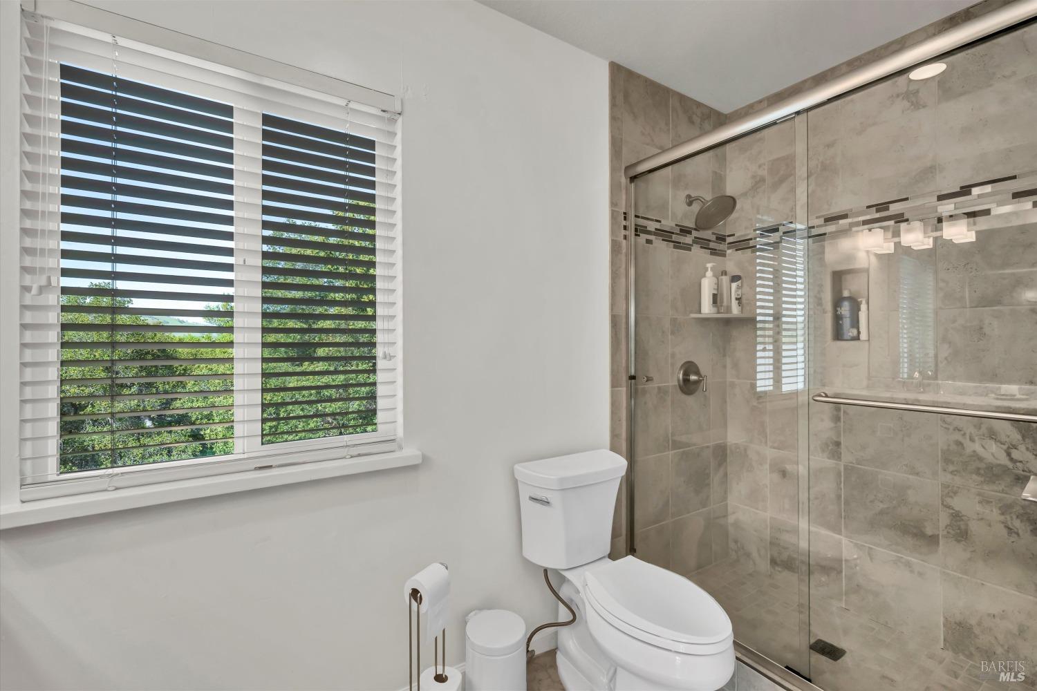 13624 Anderson Road Lower Lake, CA 95457 - Photo 18 of 31 a bathroom with a toilet and a shower