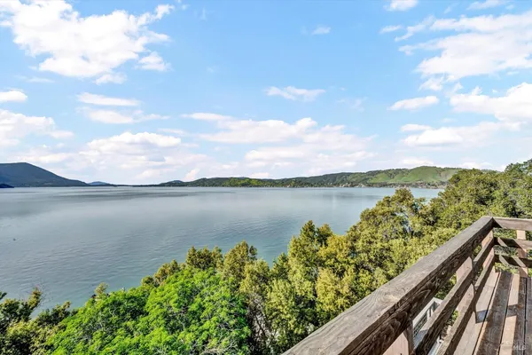 a view of a lake from a balcony