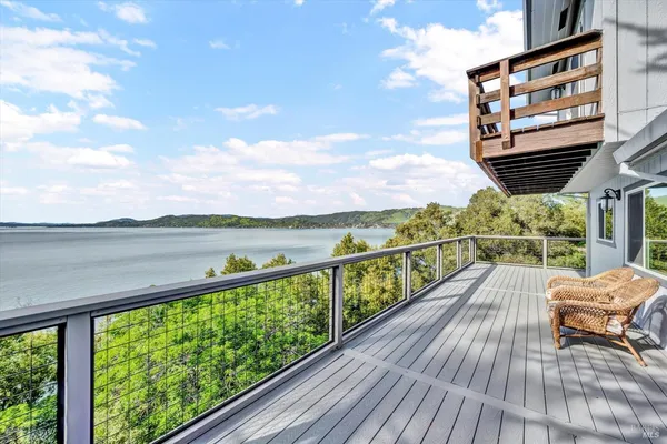 a view of balcony with couch and wooden floor
