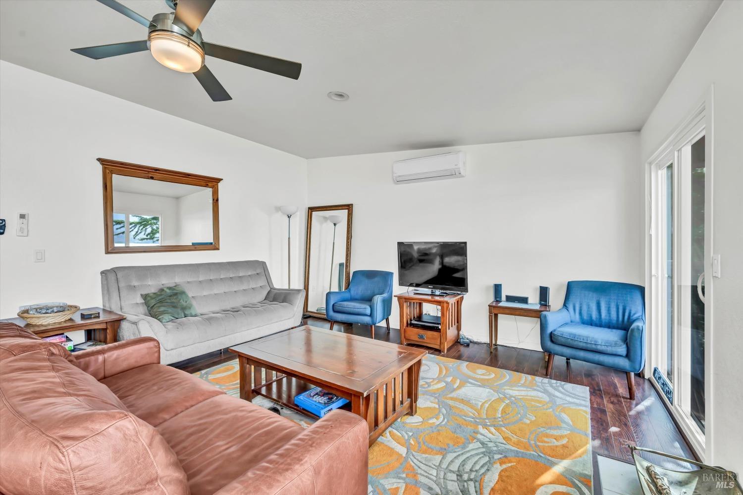 13624 Anderson Road Lower Lake, CA 95457 - Photo 10 of 31 a living room with furniture a flat screen tv and a window