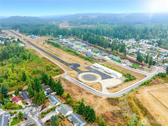 a view of a swimming pool with a yard and outdoor seating