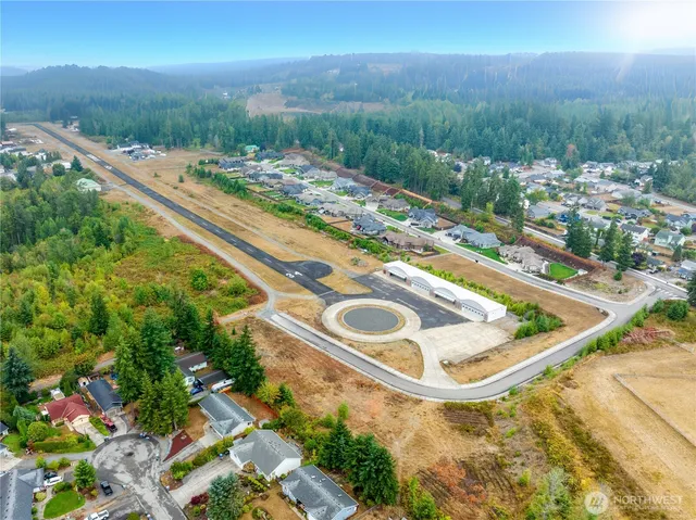 a view of a swimming pool with a yard and mountain view