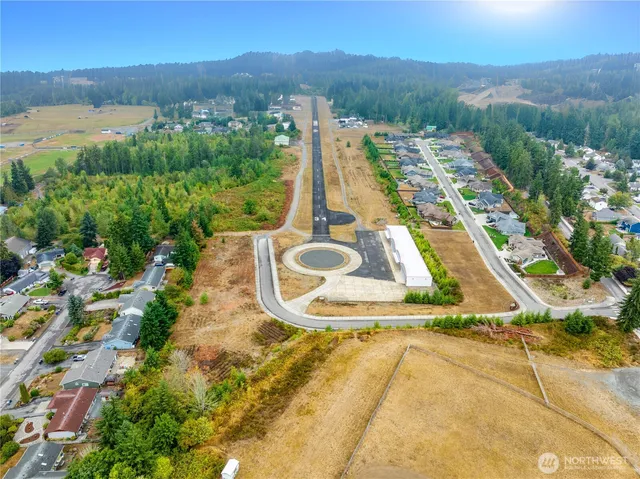 a view of a swimming pool with a yard