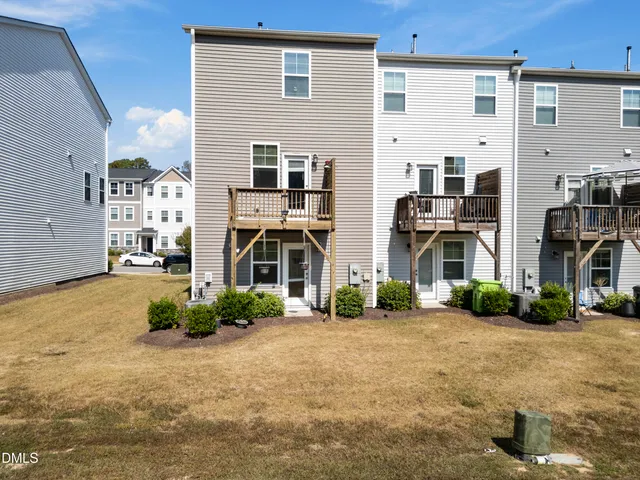 a front view of a building with a yard