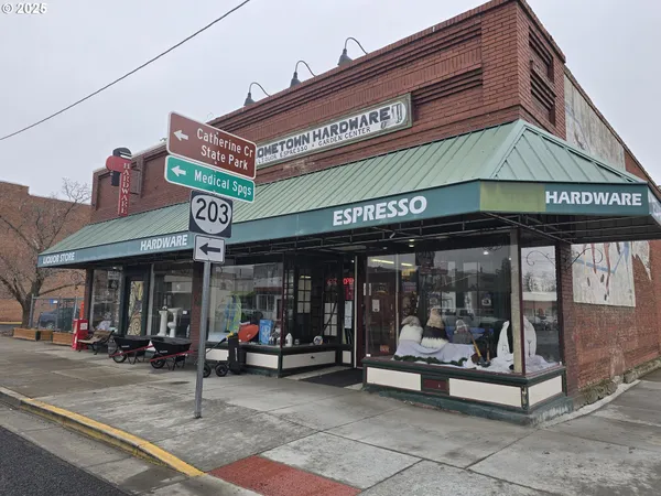 a view of a shop on the street