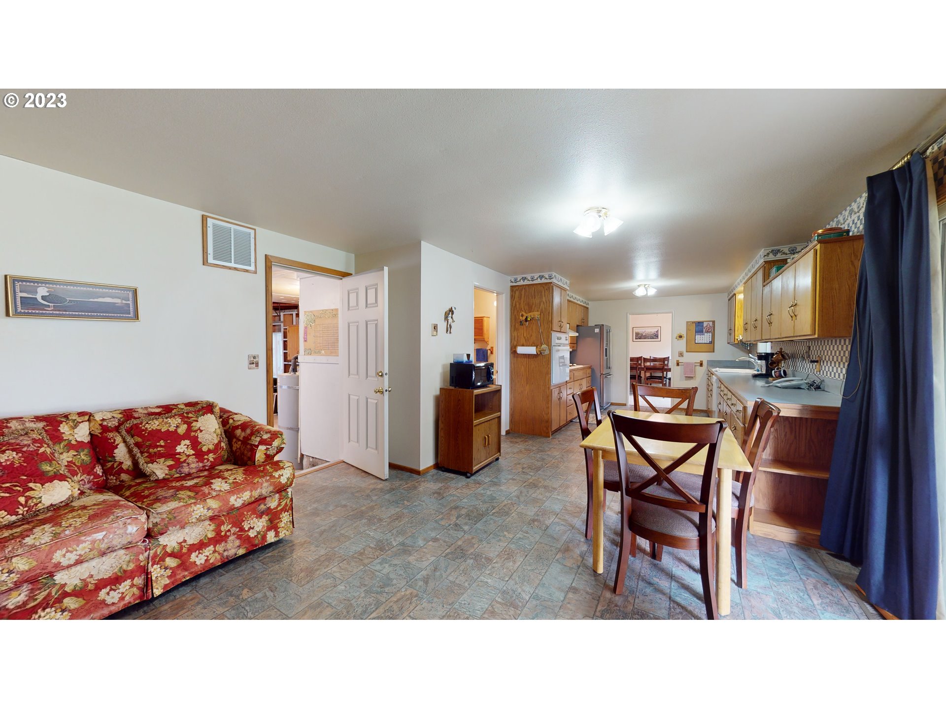 1621 Rambling Drive Springfield, OR 97477 - Photo 11 of 33 a living room with furniture and kitchen view