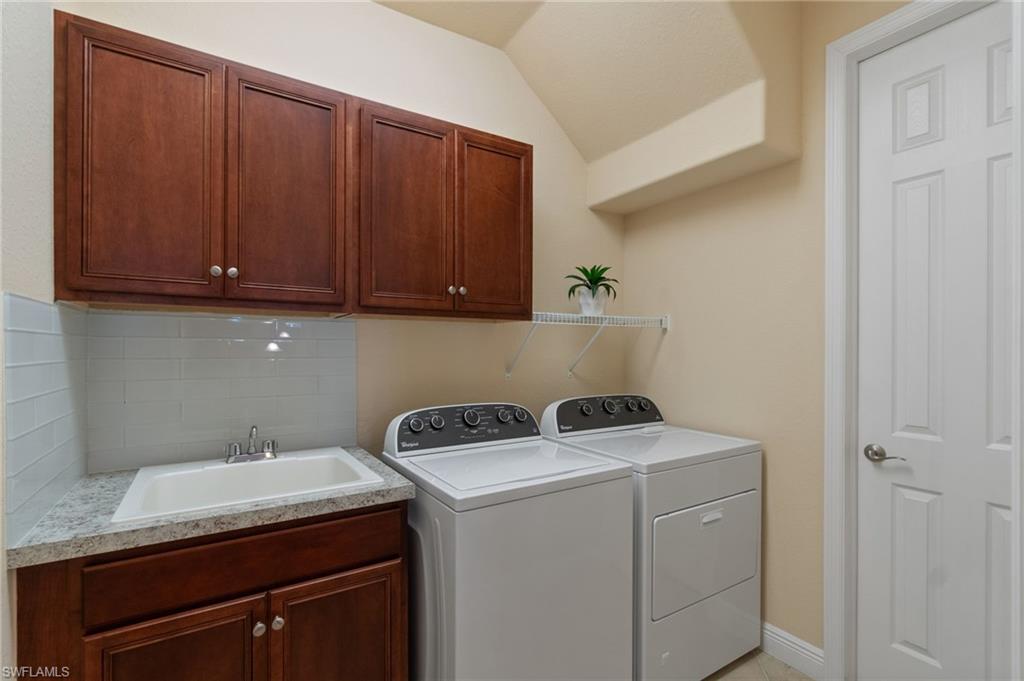 19753 Tesoro Way Estero, FL 33967 - Photo 28 of 47 a utility room with dryer and washer