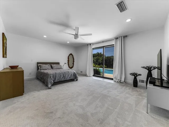 a view of a livingroom with furniture and a window
