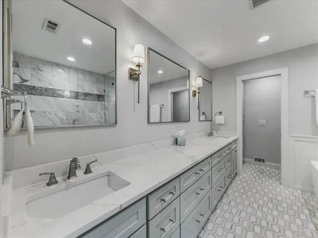 a spacious bedroom with a large bed and a large window