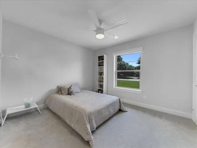 a bathroom with a sink a large mirror and a vanity