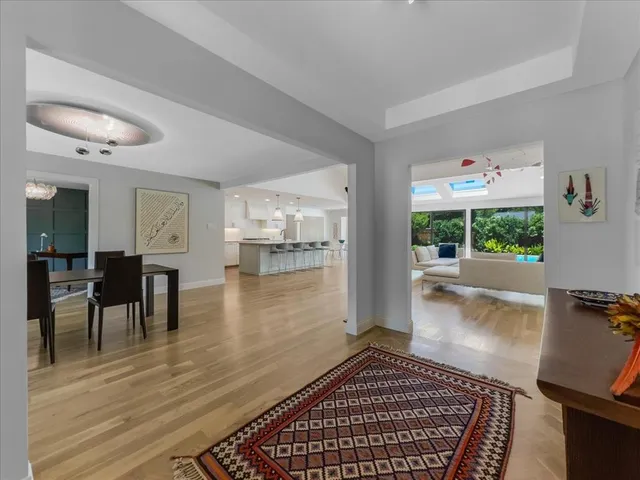 a view of a livingroom with furniture and a ceiling fan