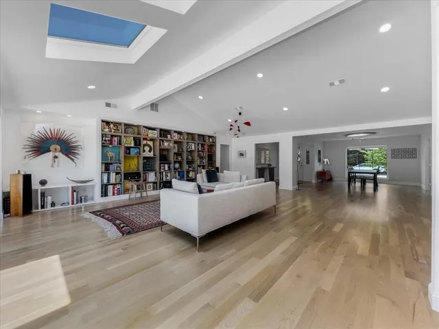 a living room with furniture and a table