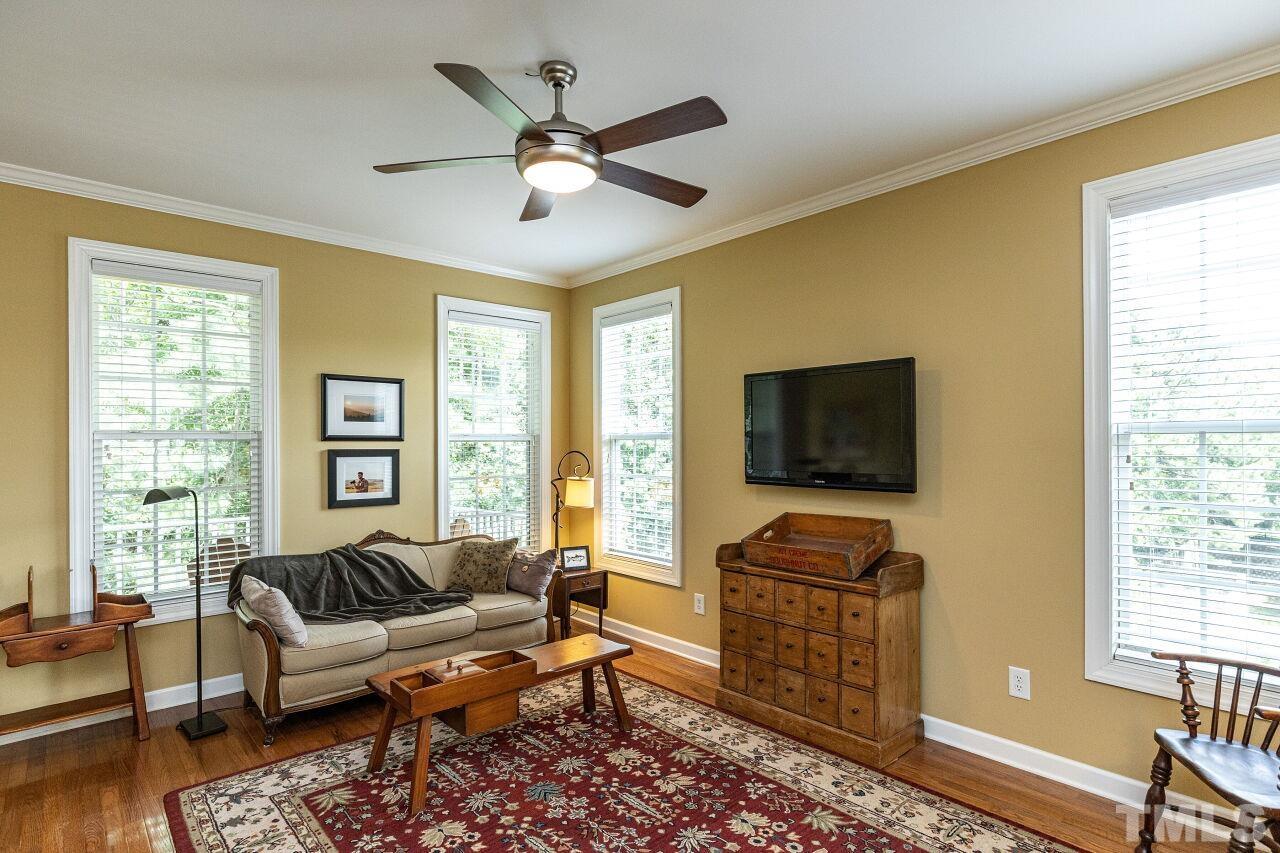 3512 Edgemont Drive Raleigh, NC 27612 - Photo 16 of 30 a living room with furniture and a flat screen tv