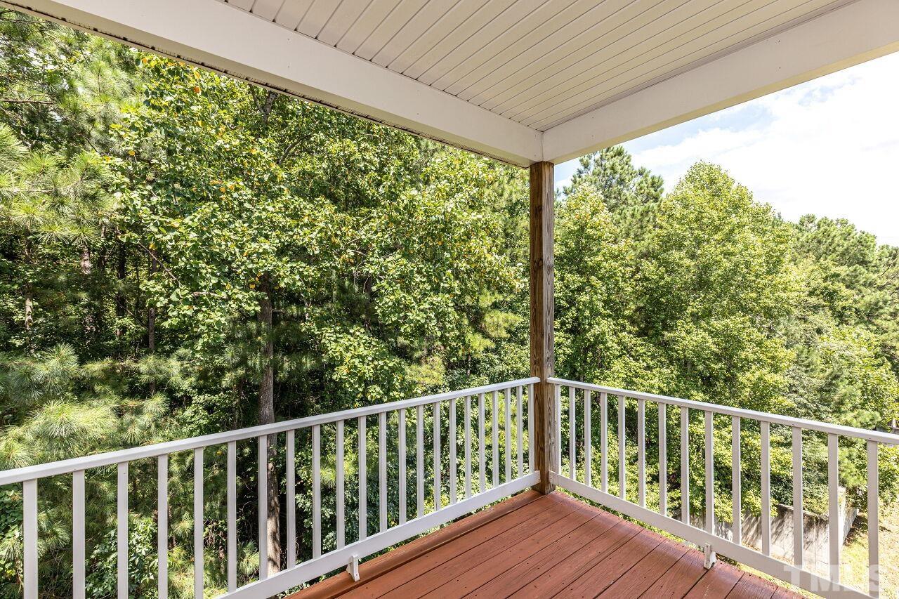 3512 Edgemont Drive Raleigh, NC 27612 - Photo 21 of 30 a view of balcony with trees