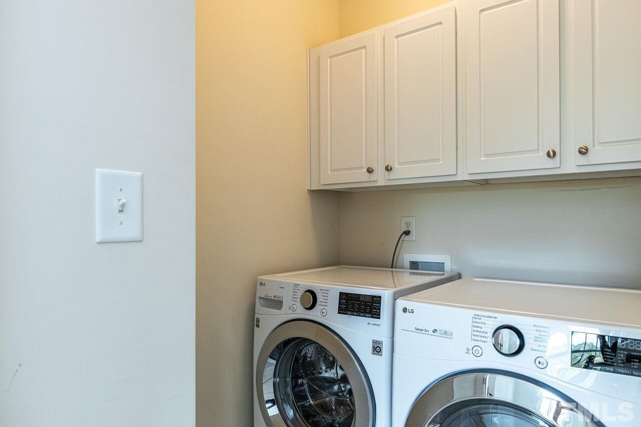 3512 Edgemont Drive Raleigh, NC 27612 - Photo 27 of 30 a utility room with dryer and washer