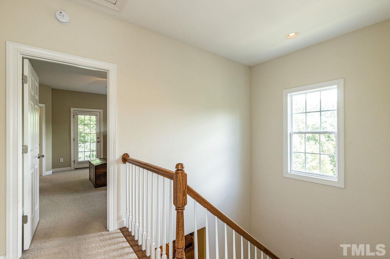 3512 Edgemont Drive Raleigh, NC 27612 - Photo 28 of 30 a view of a hallway with a window and a livingroom