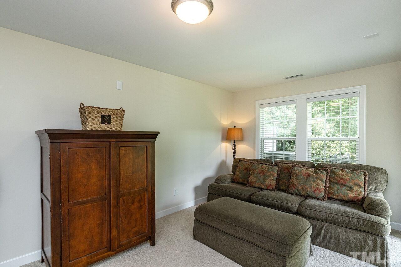 3512 Edgemont Drive Raleigh, NC 27612 - Photo 6 of 30 a living room with furniture and a window