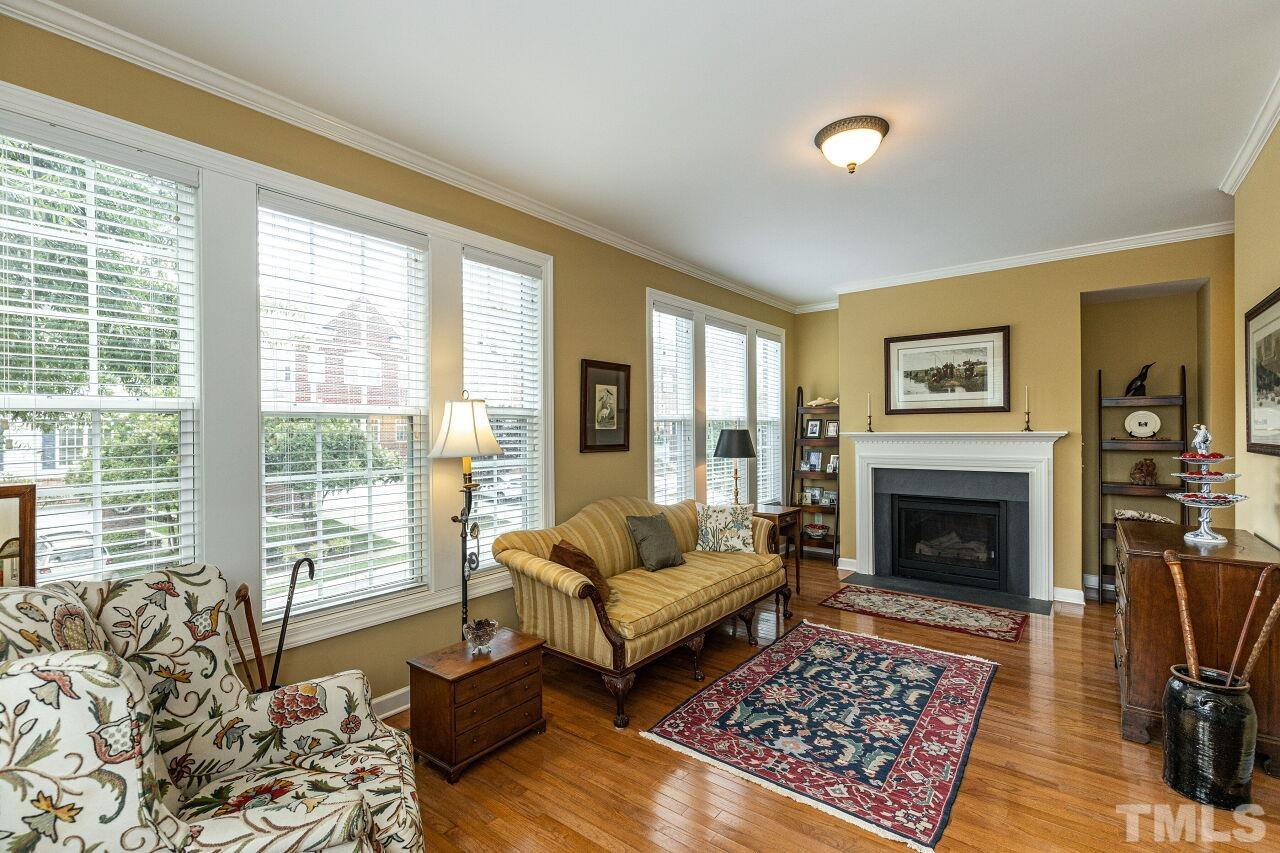3512 Edgemont Drive Raleigh, NC 27612 - Photo 9 of 30 a living room with furniture fireplace and window