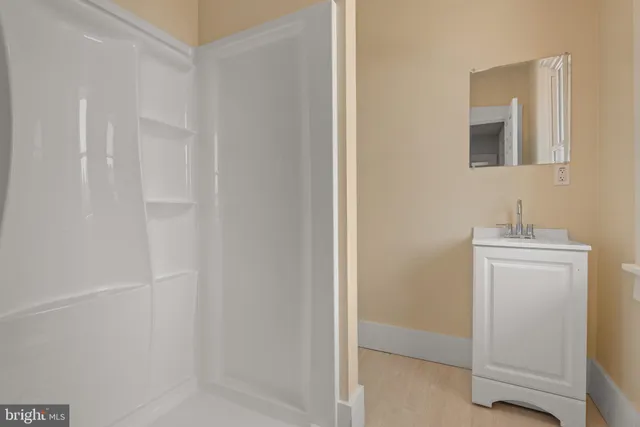 a room with a sink and a mirror