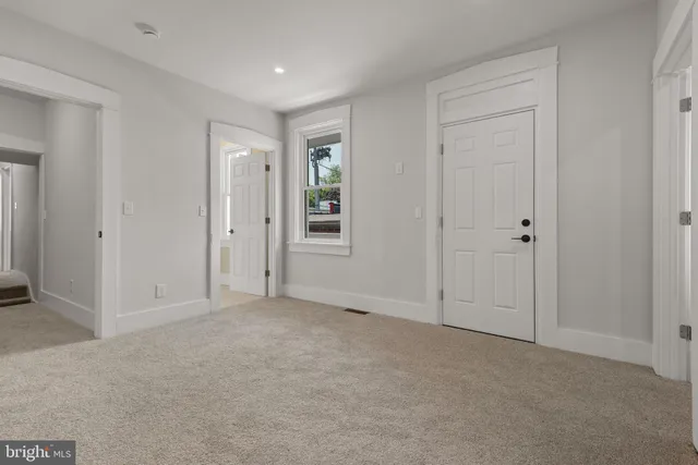 an empty room with closet area